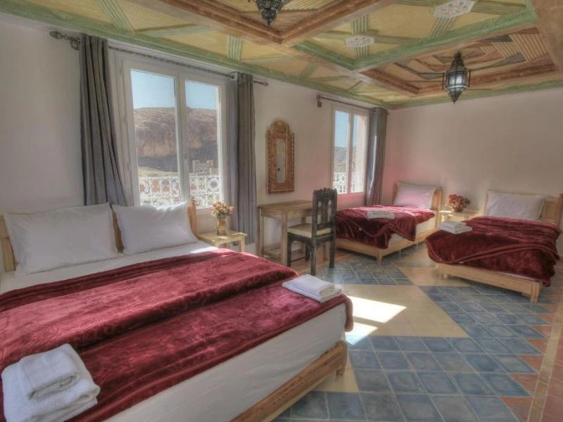 slaapkamer met meerdere bedden