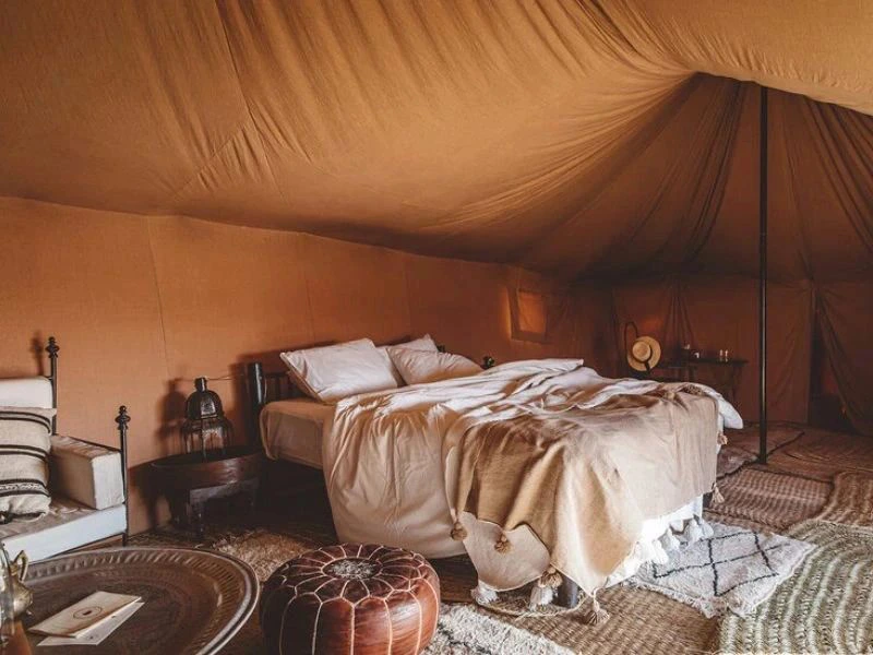 Bed in glamping tent in Agafay